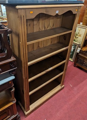 Lot 1232 - A modern pine freestanding open bookshelf with...