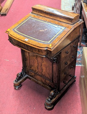 Lot 1239 - A mid-Victorian figured walnut slope front...