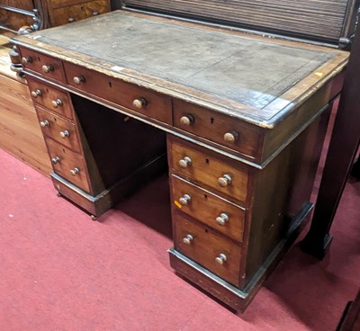 Lot 1242 - A Victorian faded walnut and leather inset...