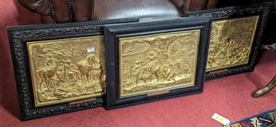 Lot 1309 - A set of three French gilt and embossed metal...