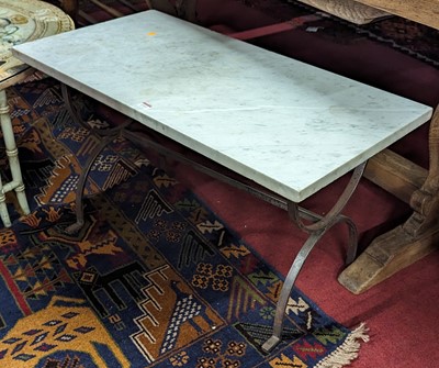 Lot 1311 - A white variegated marble topped and X-framed...