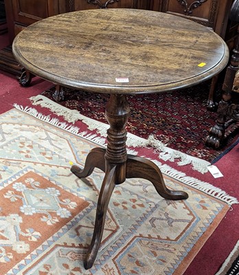 Lot 1315 - A contemporary oak circular tilt-top pedestal...