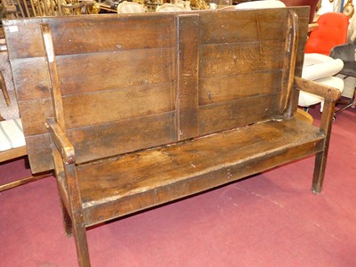 Lot 1329 - An antique joined oak and elm long bench...