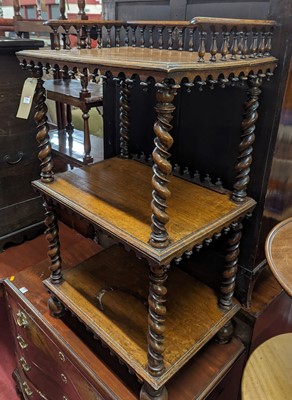 Lot 1254 - A mid-Victorian oak three-tier whatnot, having...