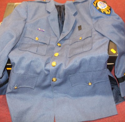 Lot 1673 - A collection of assorted police uniforms, to...