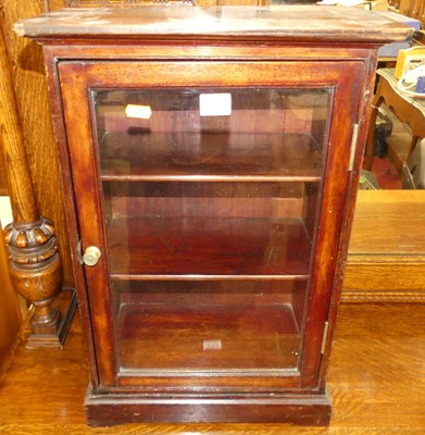 Lot 1353 - A stained mahogany single door glazed...