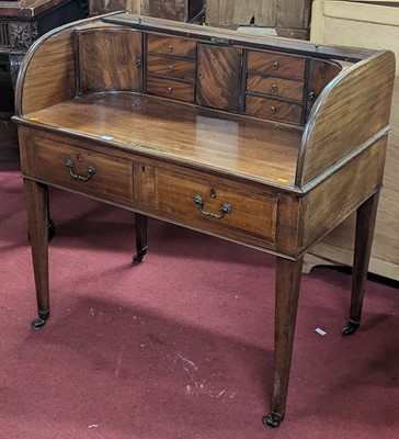 Lot 1221 - An early 19th century mahogany tambour top...