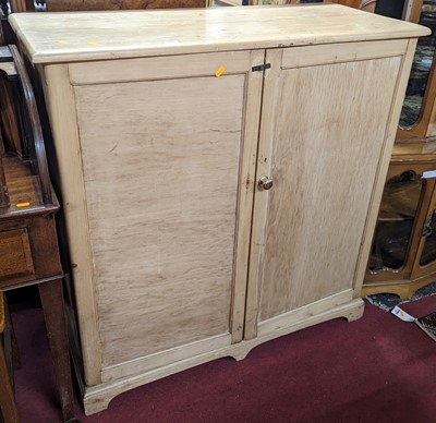 Lot 1279 - A rustic pine low double door side cupboard,...