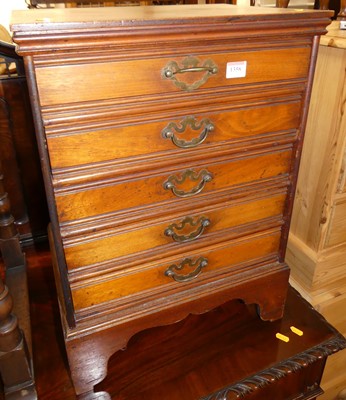 Lot 1358 - An Edwardian walnut music chest of five long...