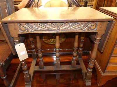 Lot 1359 - A joined oak dropflap low occasional table,...