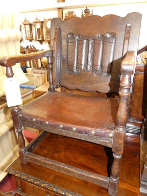 Lot 1360 - A joined oak fold-over monks chair, having a...