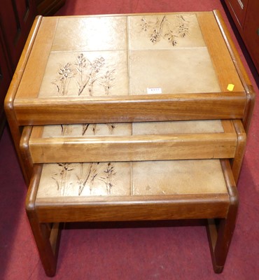 Lot 1377 - A 1970s teak and tile-top inset nest of three...