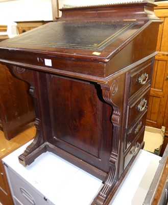 Lot 1380 - A late Victorian mahogany slopefront davenport,...