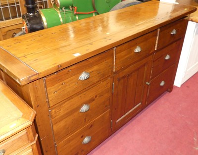 Lot 1386 - A contemporary stained pine sideboard, fitted...