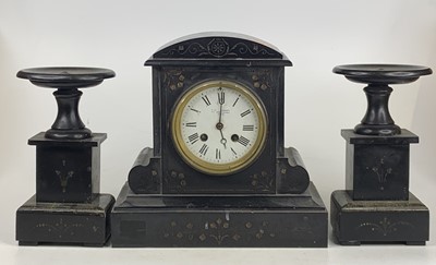 Lot 1546 - A late Victorian polished slate mantel clock,...