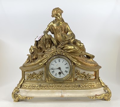 Lot 1551 - A French gilt brass and marble mantel clock,...