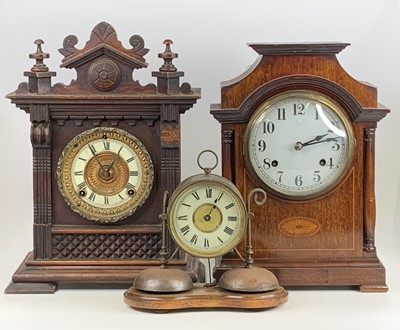 Lot 1559 - An Edwardian inlaid mahogany mantel clock,...