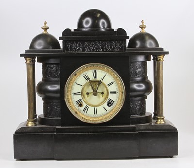 Lot 1587 - A late Victorian slate mantel clock, having...