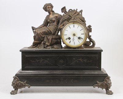 Lot 1617 - A late Victorian polished slate mantel clock,...