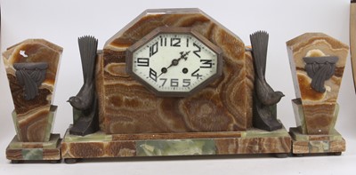 Lot 1633 - An Art Deco marble and onyx three-piece clock...