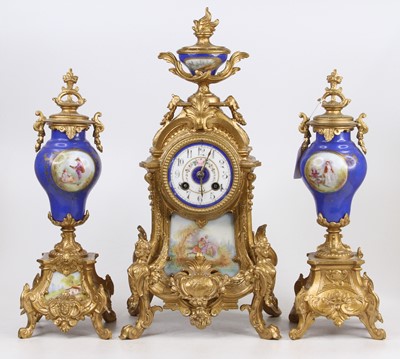 Lot 1636 - A reproduction French gilt metal and porcelain...