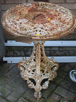 Lot 1396 - A cast and pierced metal circular garden table...