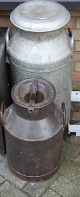 Lot 1397 - A galvanised twin handled milk churn and cover,...