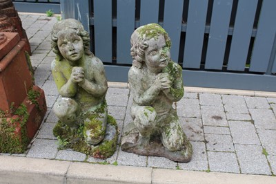 Lot 1408 - A pair of reconstituted stone garden figures,...