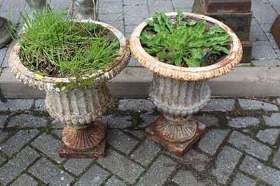 Lot 1412 - A pair of white painted cast iron pedestal...