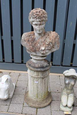 Lot 1414 - A reconstituted stone garden pedestal bust of...