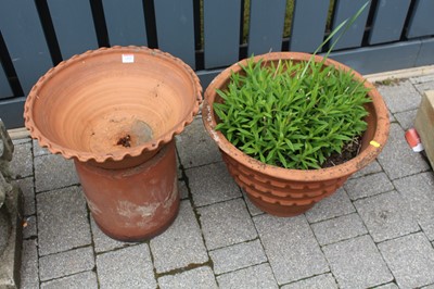 Lot 1418 - A terracotta circular garden planter, together...