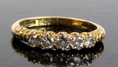 Lot 2323 - An 18ct yellow gold diamond half hoop eternity...