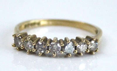 Lot 2621 - An 18ct yellow gold diamond half hoop eternity...