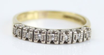 Lot 2624 - An 18ct yellow and white gold diamond half...