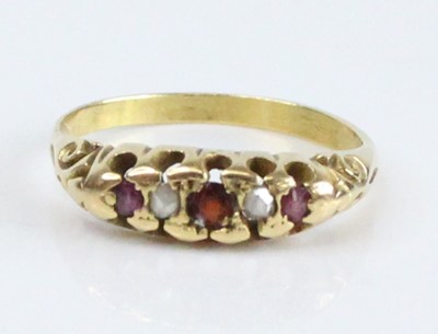 Lot 2626 - A yellow metal, garnet, diamond and ruby half...