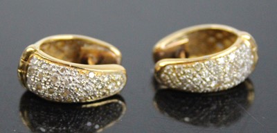 Lot 2627 - A pair of yellow metal diamond hinged huggy...