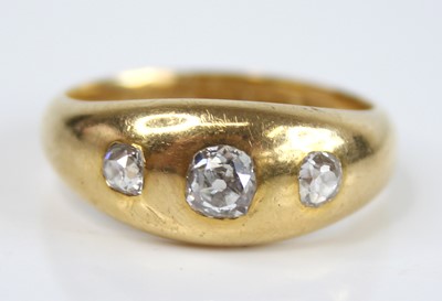 Lot 2870 - A gent's 18ct gold diamond three-stone ring,...