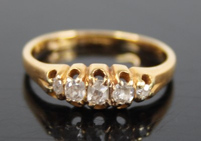 Lot 2777 - An 18ct gold diamond half hoop ring, arranged...