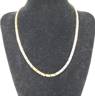 Lot 2780 - A modern 9ct gold brick-link necklace, each...