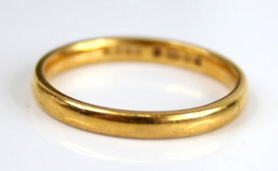 Lot 2782 - A 22ct gold court shaped wedding band, sponsor...