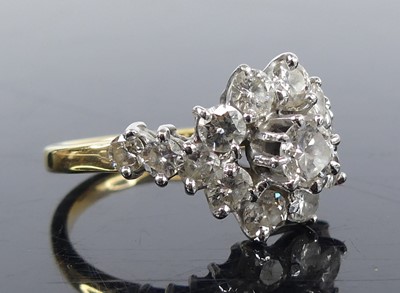 Lot 2321 - An 18ct yellow and white gold diamond circular...