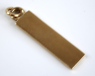Lot 2402 - A modern 9ct gold ingot pendant, sponsor WG&S,...