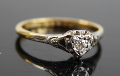 Lot 2408 - An 18ct gold diamond solitaire ring, the heart...