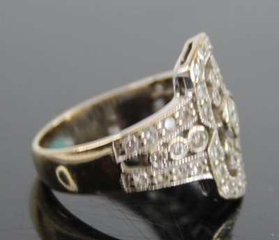 Lot 2409 - An Art Deco white metal diamond cluster ring,...