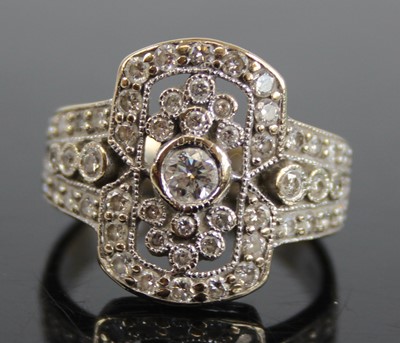 Lot 2409 - An Art Deco white metal diamond cluster ring,...