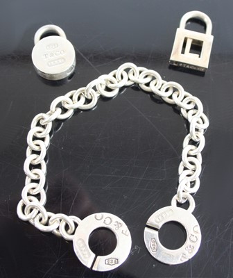 Lot 2413 - A Tiffany & Co silver bracelet, 19.5cm;...