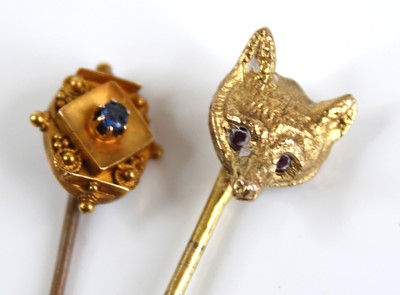 Lot 2442 - A 15ct gold round cut sapphire set tie-pin,...