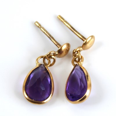 Lot 2443 - A pair of 18ct gold and pear cut amethyst set...
