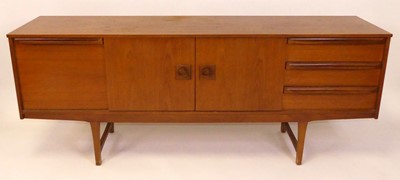 Lot 358 - A 1960s teak long sideboard, having twin...