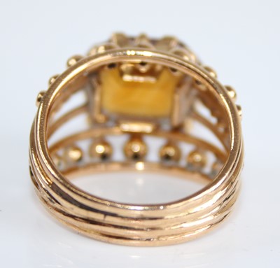 Lot 2430 - A yellow metal and citrine set dress ring, the...